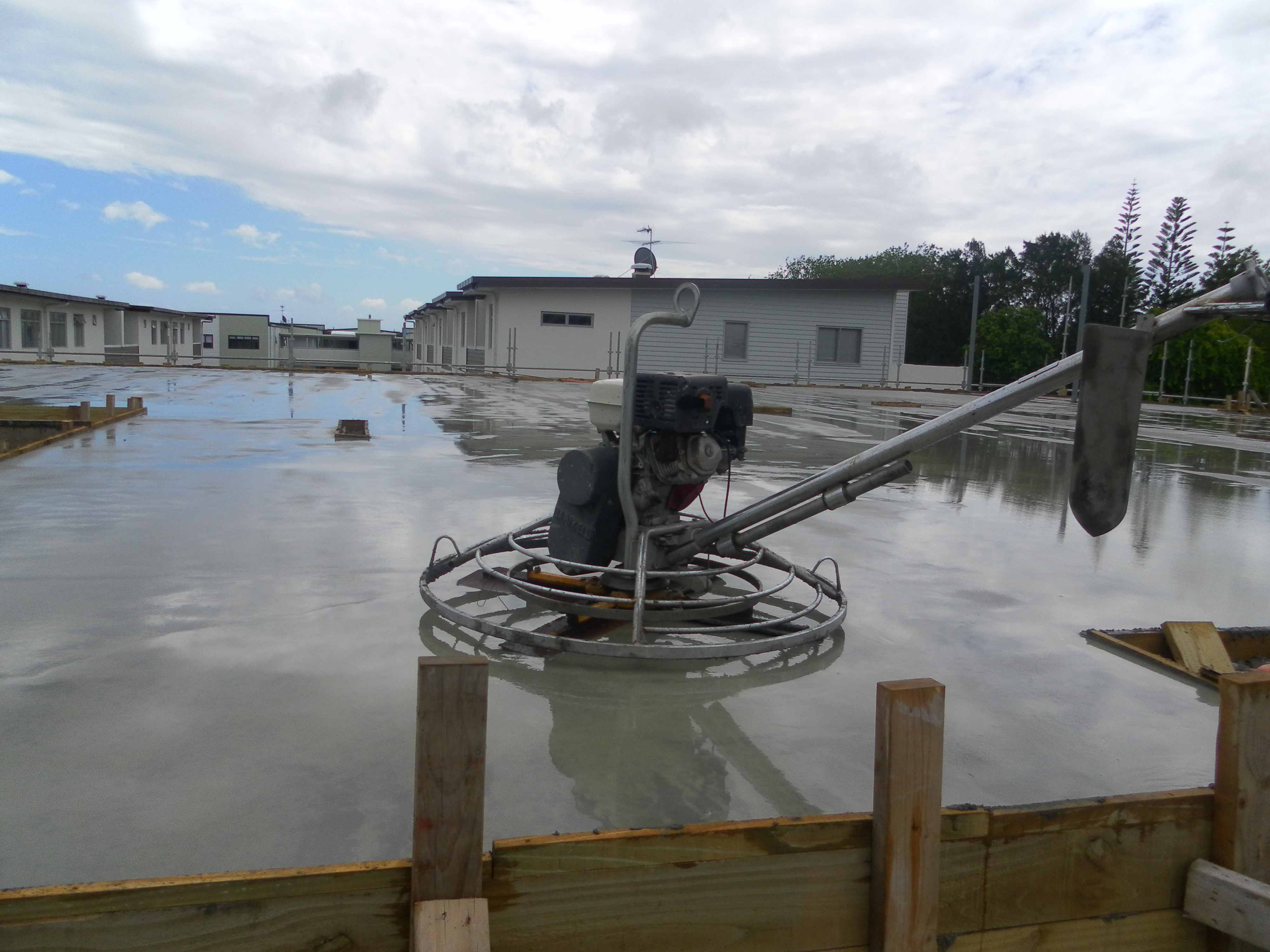 Fresh concrete slab being finished