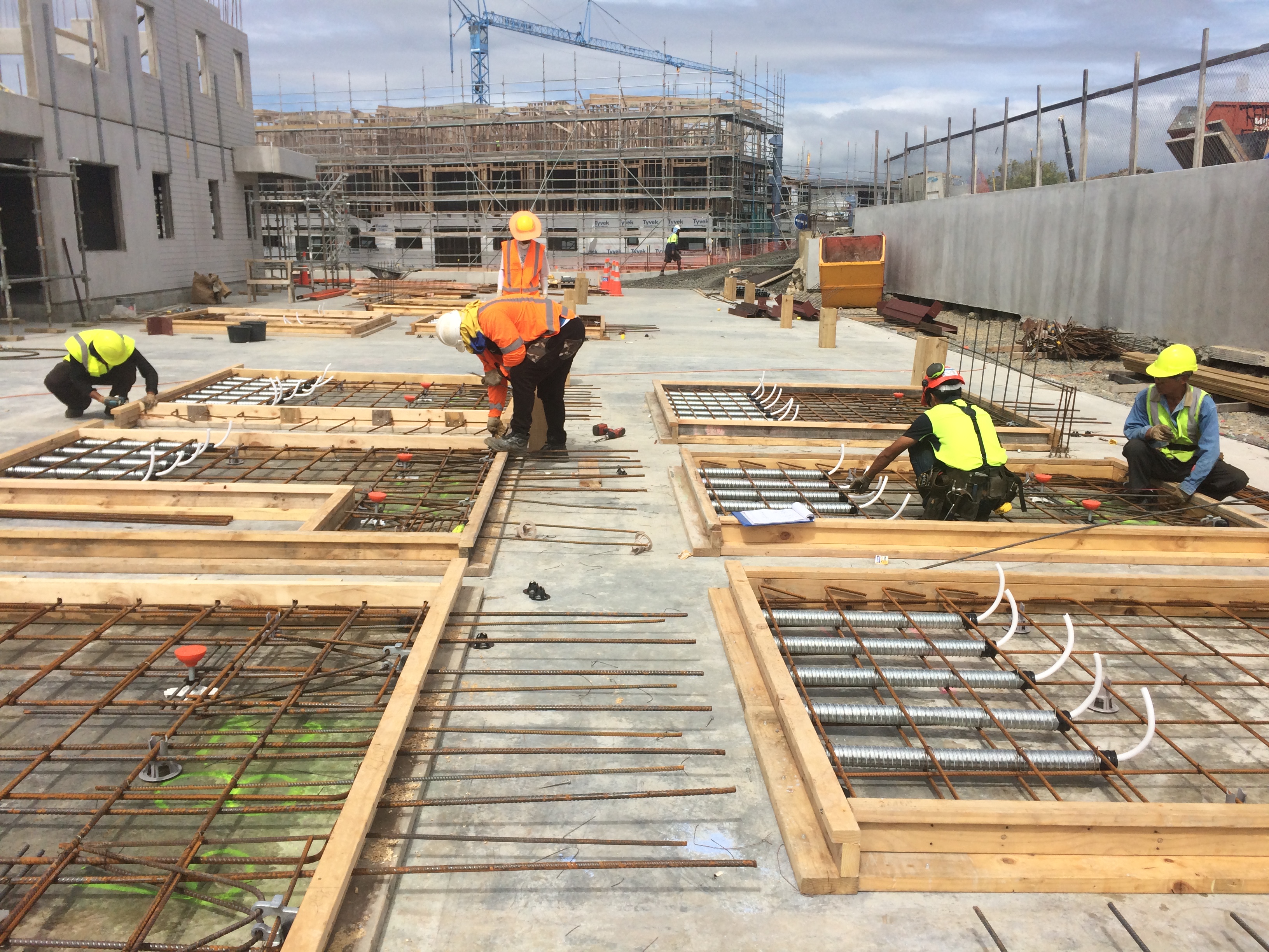 Workers preparing slab formwork